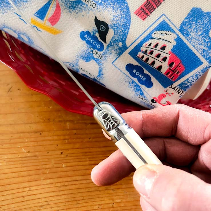 Laguiole Cream Bread knife bee emblem detail at Clementine Boutique