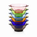 A stack of six translucent glass bowls in different colors, including pink, green, blue, orange, purple, and dark smoky gray, on a white background.