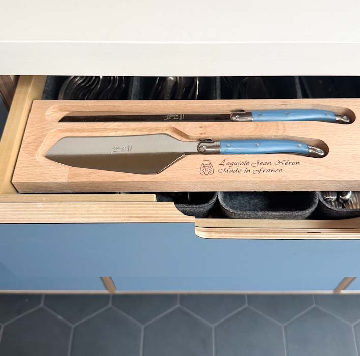 Laguiole Cake Slicer and Bread Knife Set, Pastel Blue Handles in a wooden tray in the kitchen drawer