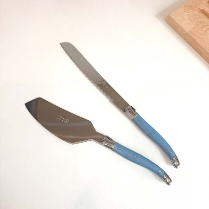 Laguiole Cake Slicer and Bread Knife Set, Pastel Blue Handles on white countertop