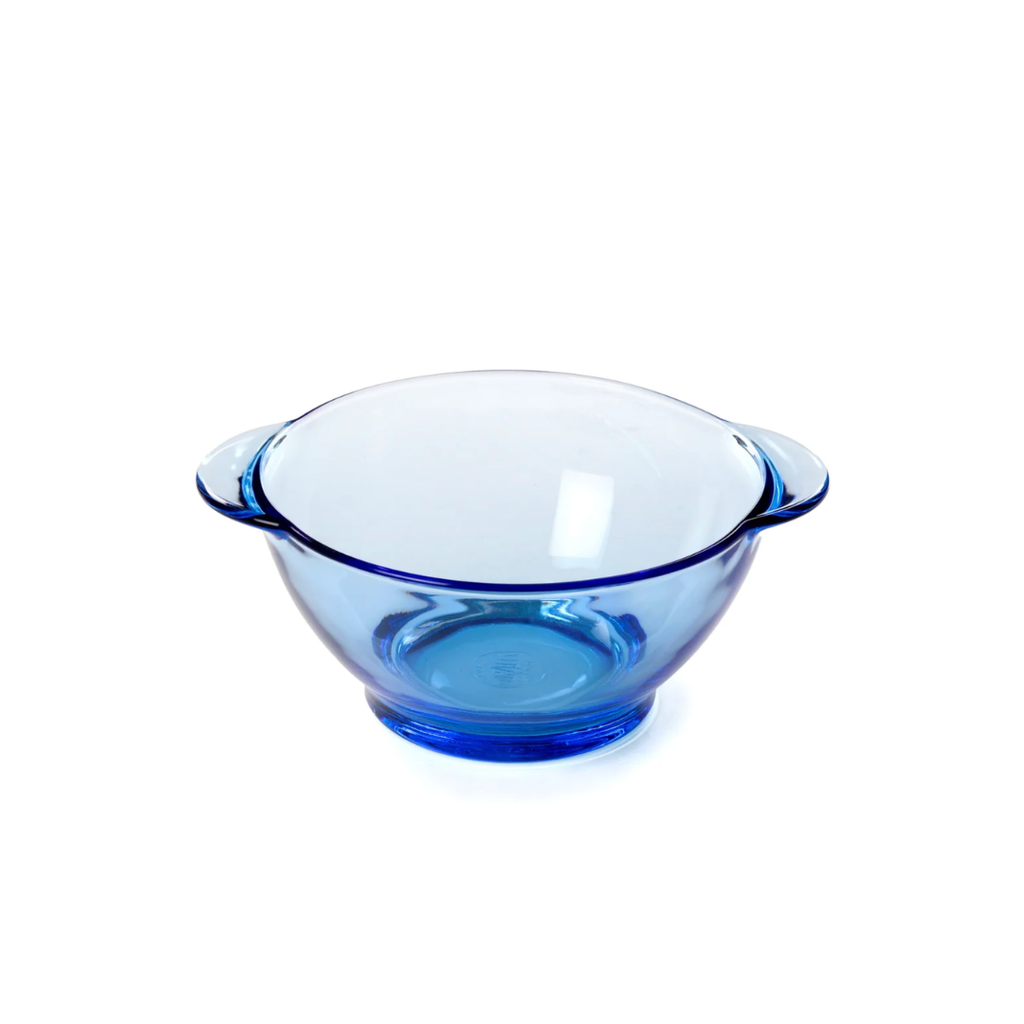 A translucent blue glass bowl with small side handles and a flat base, Duralex Marine Bowl Made in France Clementine Boutique